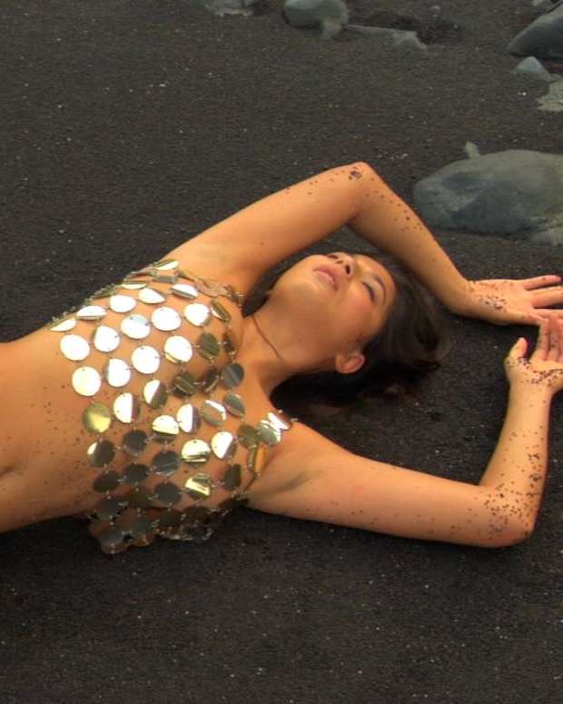 Cintia Dicker gets dirty during her SI Swimsuit shoot